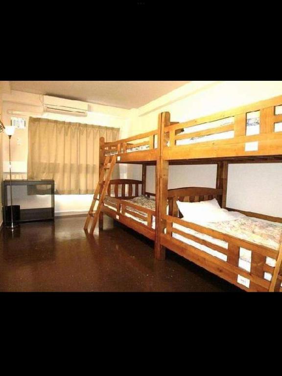 Postel nebo postele na pokoji v ubytování Fukuoka Share Hotel