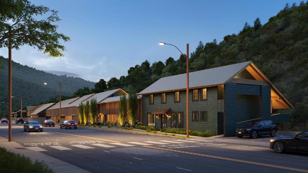 a building on the side of a street with cars at Historic Rocky Waters Inn, A Small Luxury Hotel in Gatlinburg