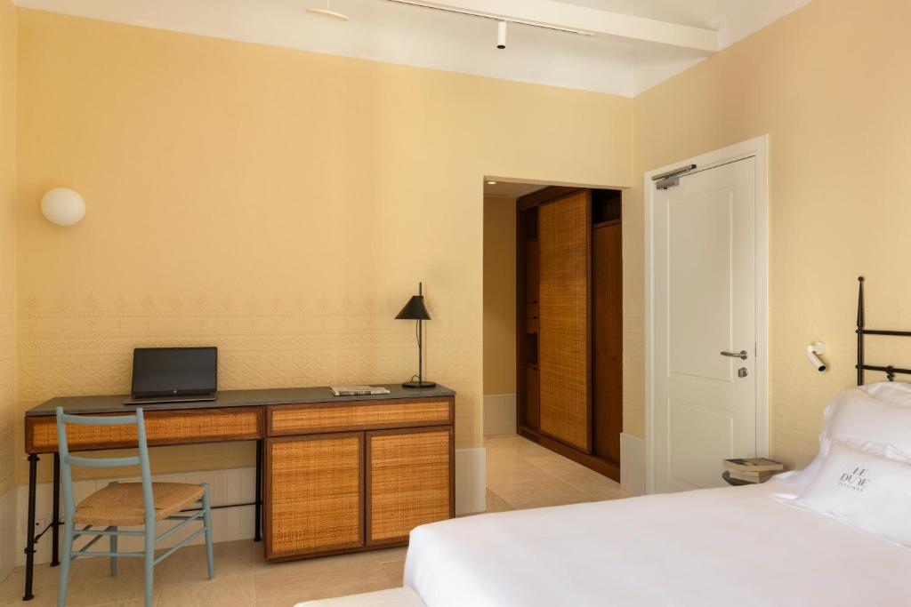 Cama ou camas em um quarto em Hotel Le Dune Piscinas