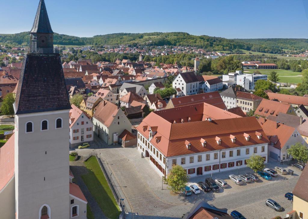an aerial view of a town with a church at Post Berching in Berching