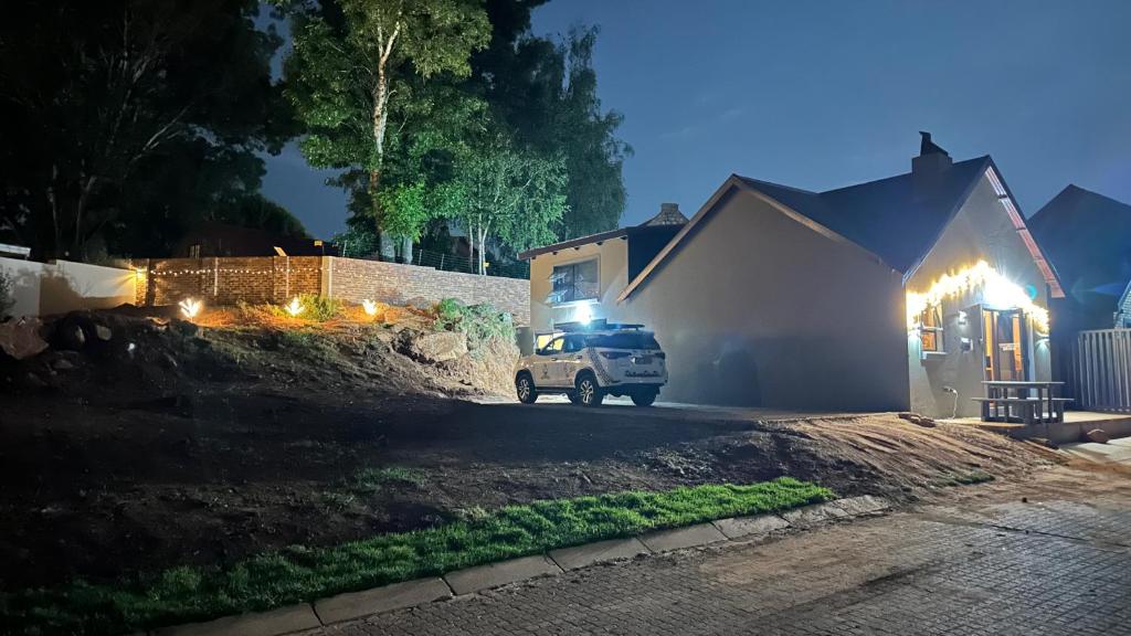 a truck parked in front of a house at night at Dullstroom Selfcatering Blue Crane Estate in Dullstroom