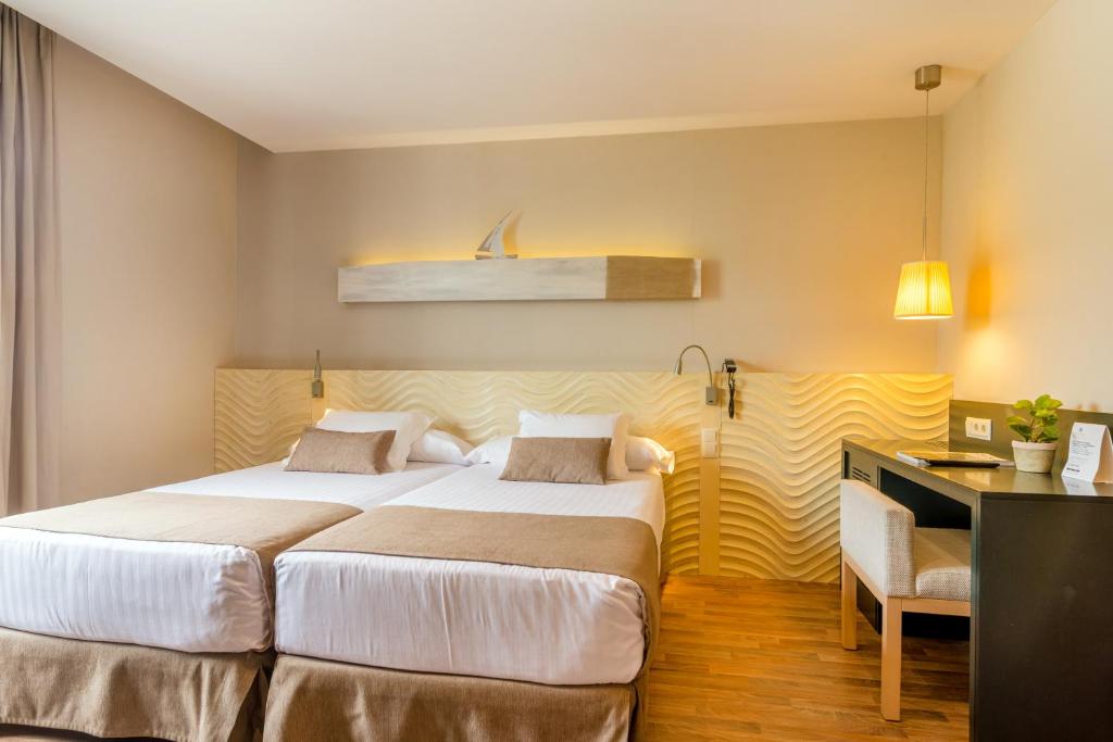 Posteľ alebo postele v izbe v ubytovaní Hotel Alga