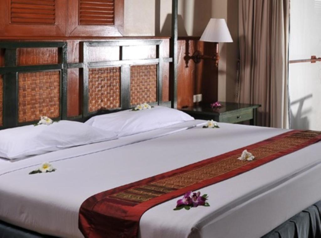 Postel nebo postele na pokoji v ubytování Karon Princess Hotel SHA EXTRA Plus