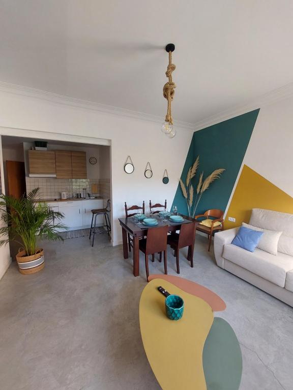 a living room with a couch and a table at Sara's apartment Barcelona in El Prat de Llobregat