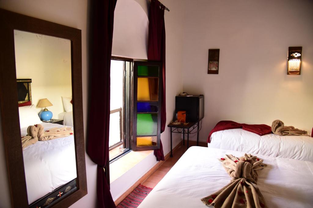 Postel nebo postele na pokoji v ubytování Riad Du Petit Prince