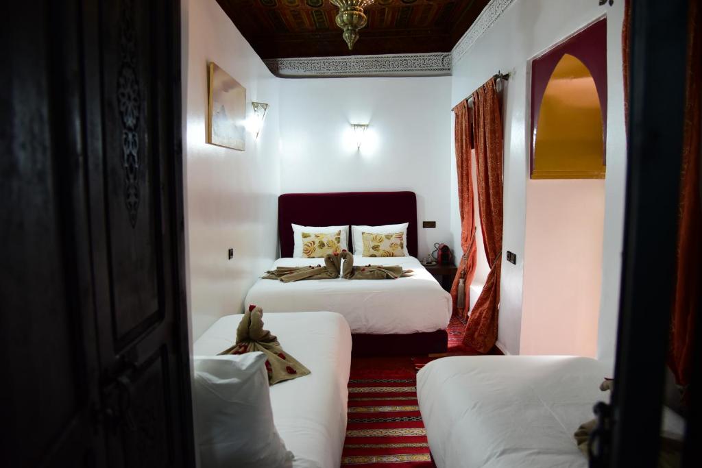 Postel nebo postele na pokoji v ubytování Riad Du Petit Prince