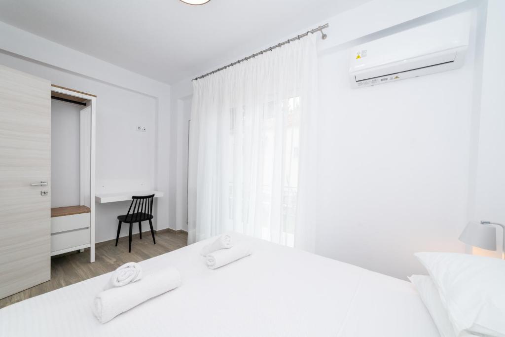 Postel nebo postele na pokoji v ubytování Anastasia Residential Complex