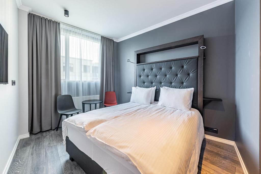 Postel nebo postele na pokoji v ubytování Hotel Aska