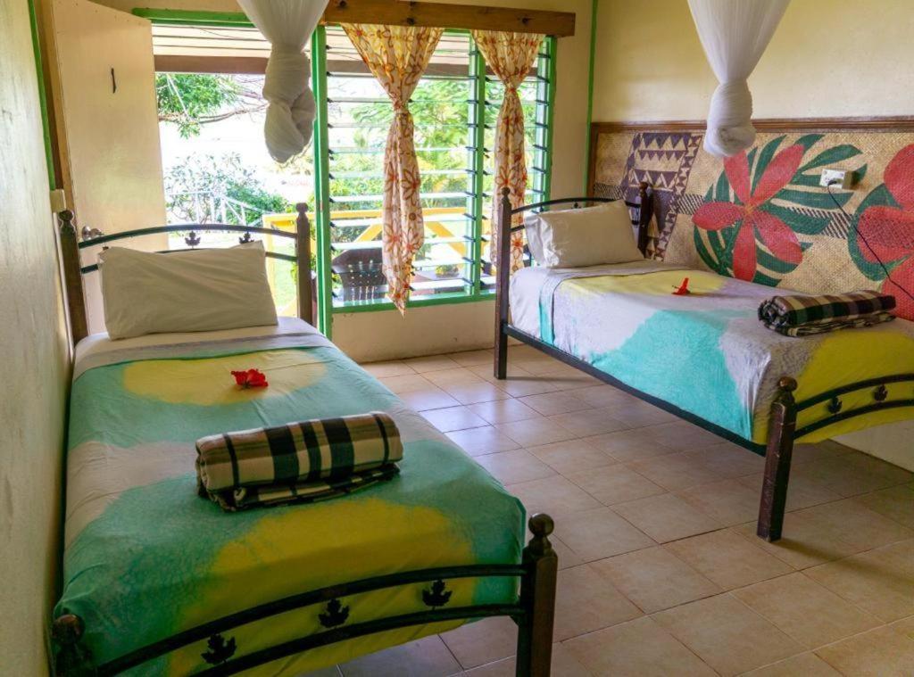 Postel nebo postele na pokoji v ubytování Waya Lailai Eco Haven