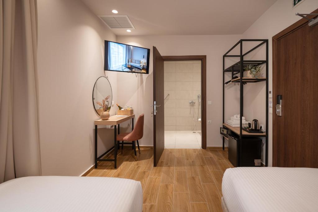 Postel nebo postele na pokoji v ubytování IRA - ΗΡΑ Hotel