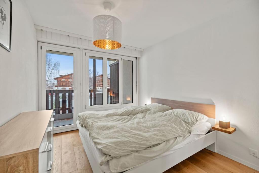 Postel nebo postele na pokoji v ubytování Appartement calme et accueillant à Charmey