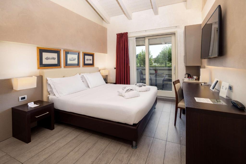Łóżko lub łóżka w pokoju w obiekcie Best Western Plus Hotel Modena Resort