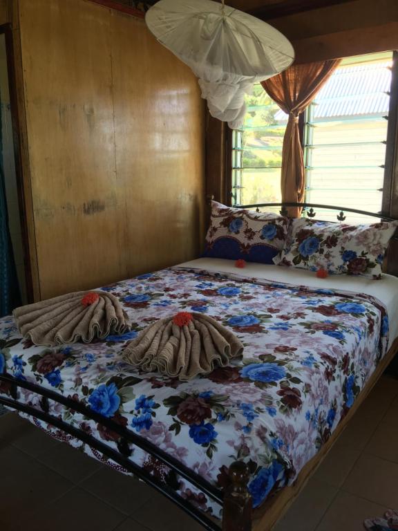 Postel nebo postele na pokoji v ubytování Waya Lailai Eco Haven