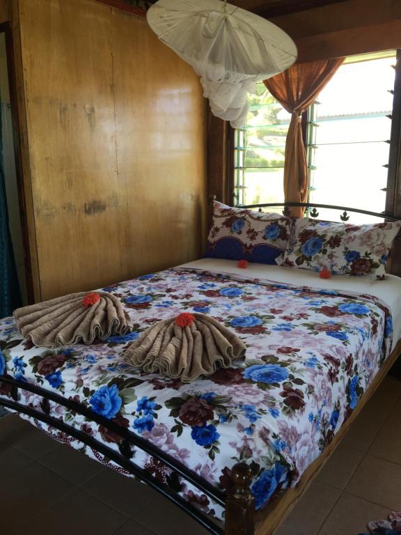 Postel nebo postele na pokoji v ubytování Waya Lailai Eco Haven