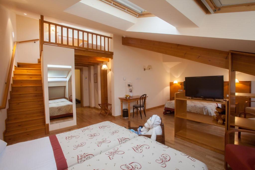 Postel nebo postele na pokoji v ubytování Hotel Bonavida