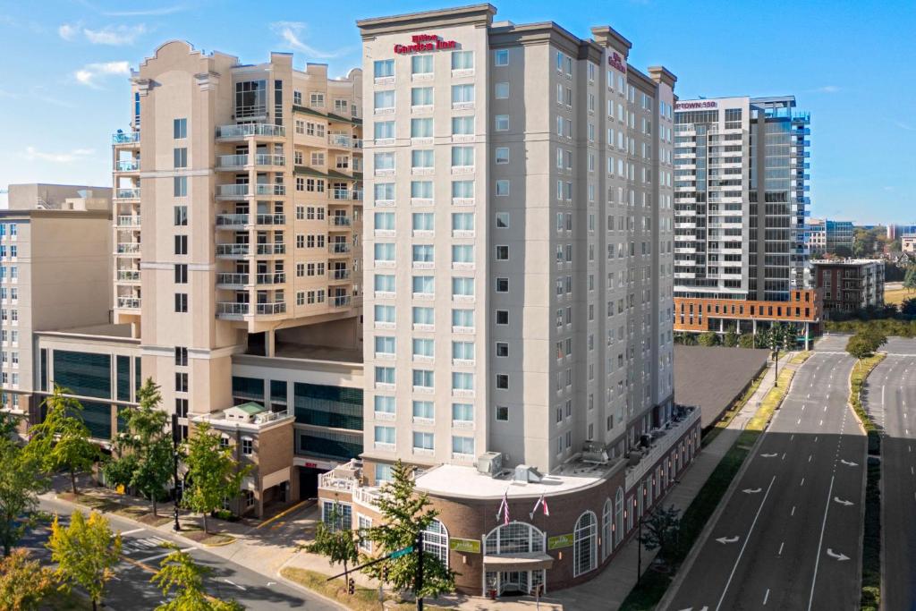 an aerial view of a tall building in a city at Hilton Garden Inn Charlotte Uptown in Charlotte