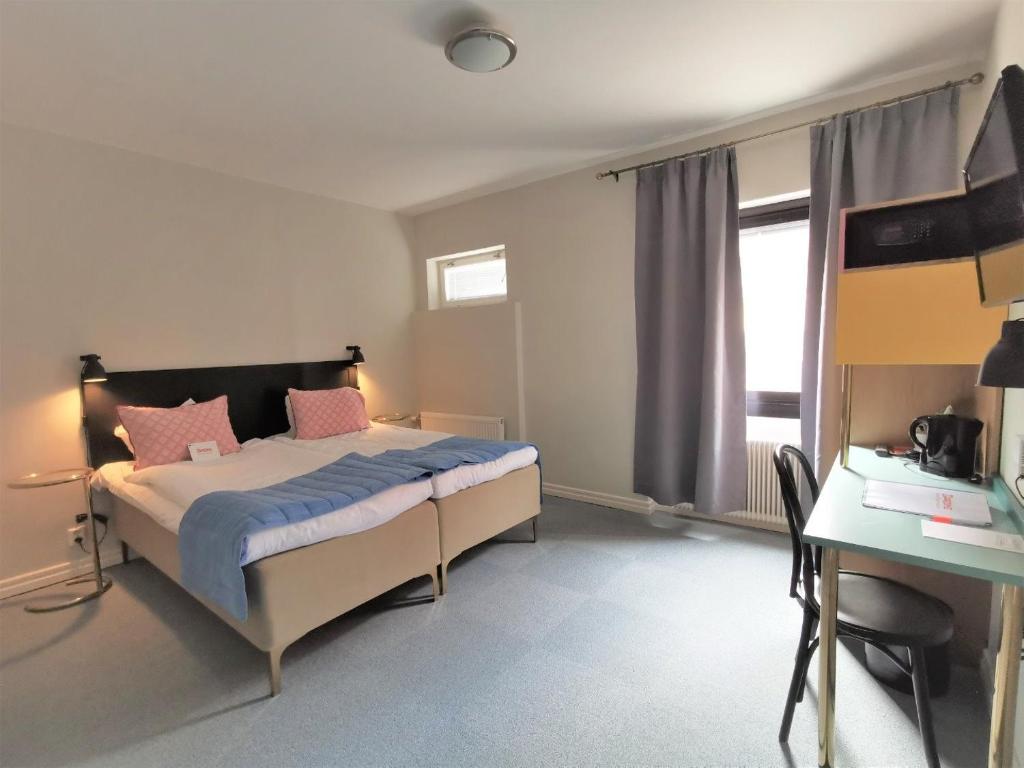 Postel nebo postele na pokoji v ubytování 2Home Hotel Gävle