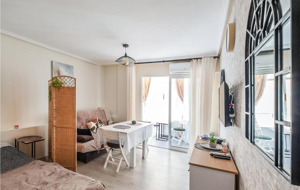 a small apartment with a kitchen and a living room at Gorgeous Apartment In Torrevieja With Kitchen in Torrevieja