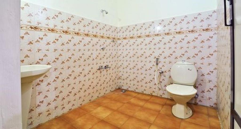 Koupelna v ubytování Hotel Srinivas