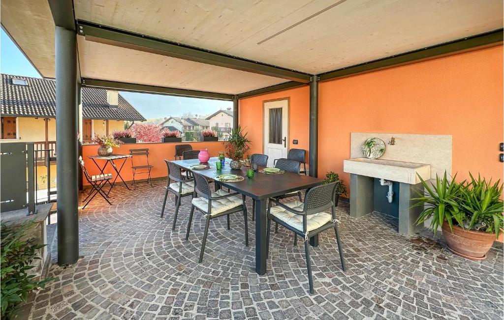 a patio with a table and chairs on a patio at Awesome Apartment In Pedavena With Wifi in Pedavena