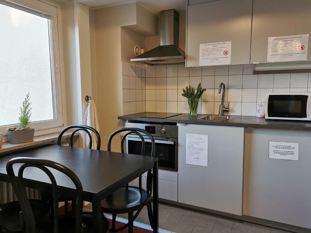 Kuchyň nebo kuchyňský kout v ubytování 2Home Hotel Gävle