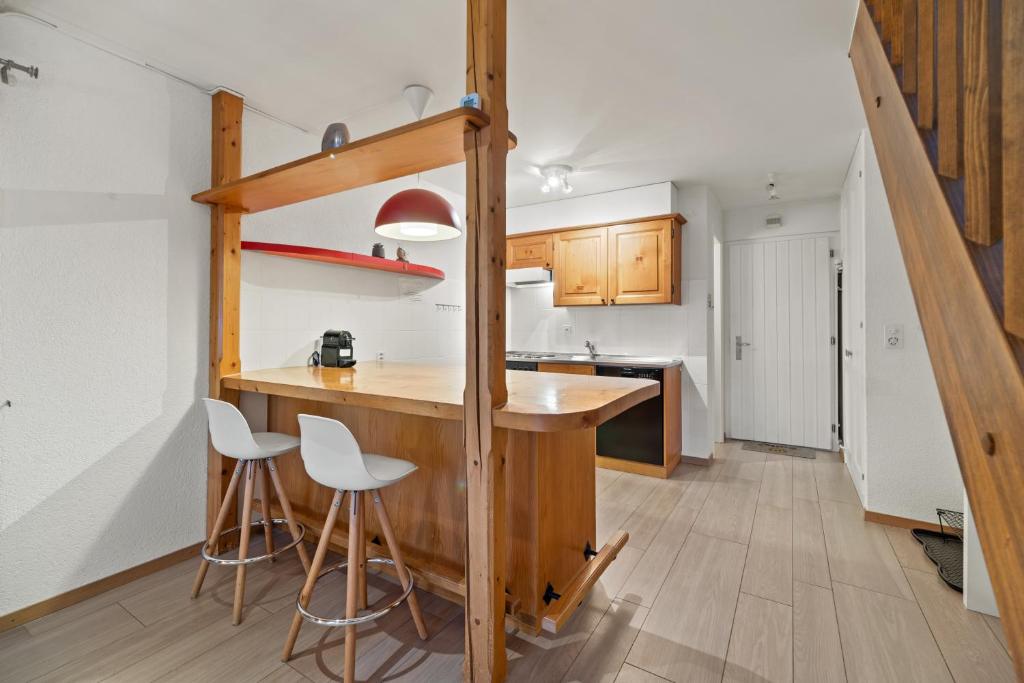 Kuchyň nebo kuchyňský kout v ubytování Cosy appartement lumineux et spacieux à Charmey
