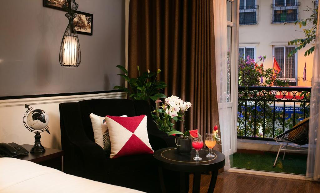 Postel nebo postele na pokoji v ubytování Hanoi Garden Hotel & Spa