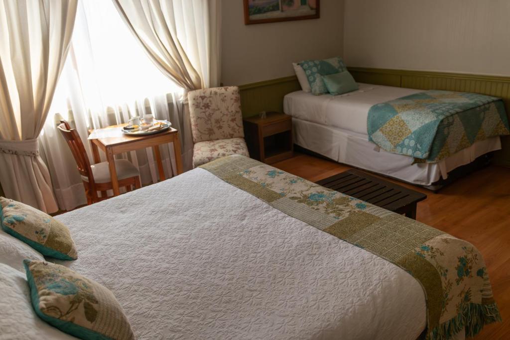 Postel nebo postele na pokoji v ubytování Hotel Di Torlaschi