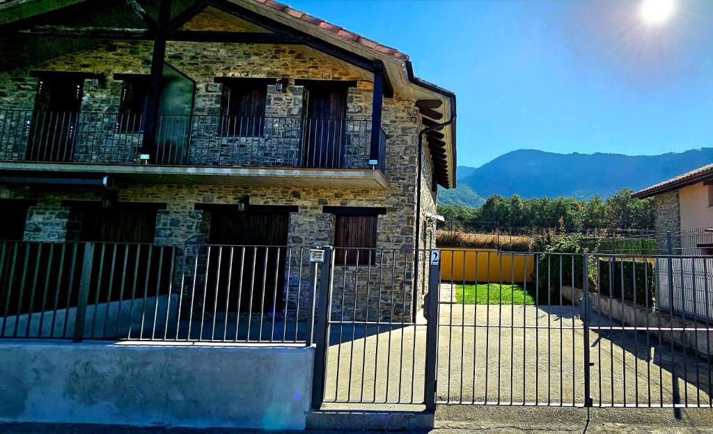 an old building with a gate in front of it at CASA COTIELLA RAÑIN in Rañín