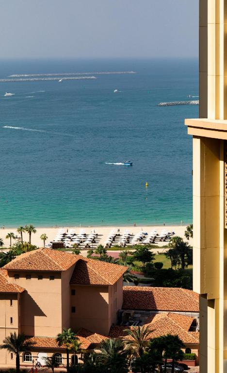 a view of the beach from a building at Happy ACADEMIA JBR in Dubai