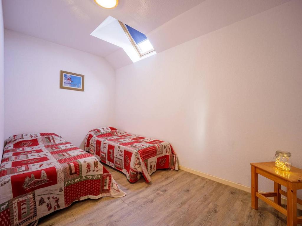 Posteľ alebo postele v izbe v ubytovaní Grand appartement 12 pers. à Peyragudes avec balcon - FR-1-695-8