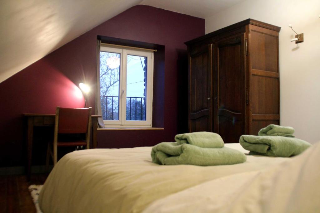 Un ou plusieurs lits dans un hébergement de l'établissement Gîte du Chat noir (Brocéliande)