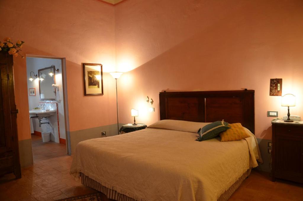 Postel nebo postele na pokoji v ubytování Cortona Resort-Le Terre Dei Cavalieri