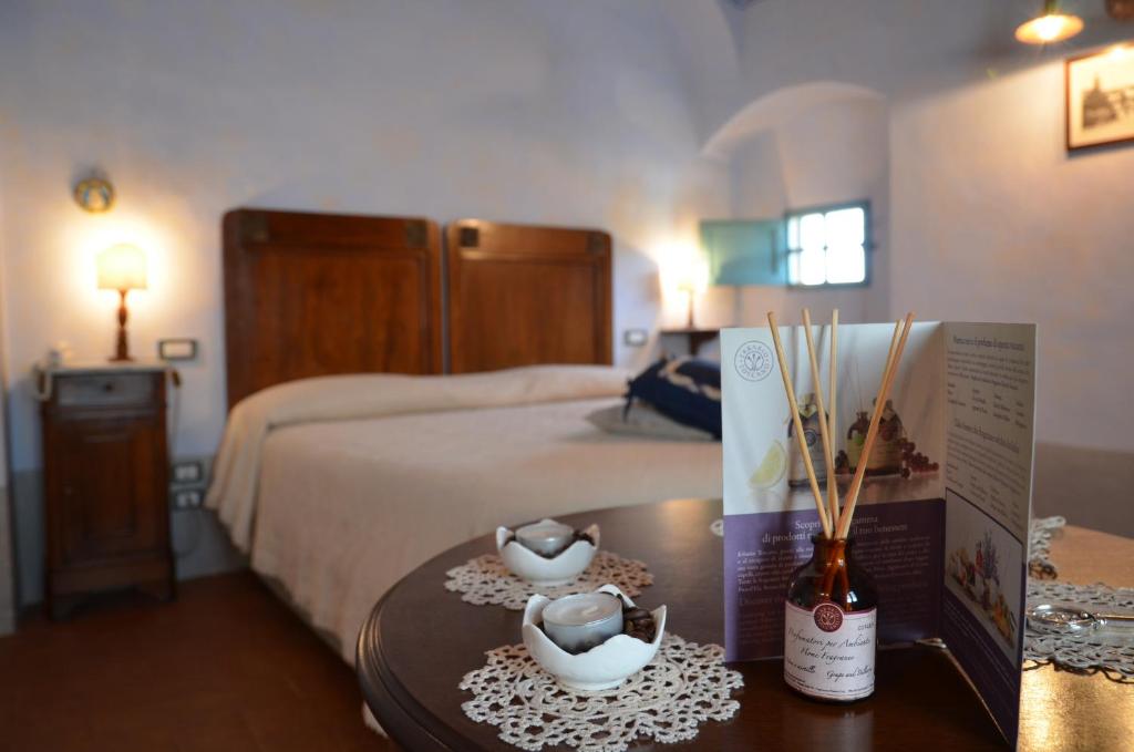 Postel nebo postele na pokoji v ubytování Cortona Resort-Le Terre Dei Cavalieri