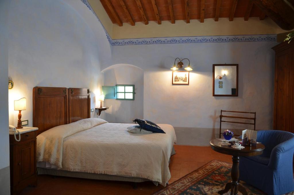 Postel nebo postele na pokoji v ubytování Cortona Resort-Le Terre Dei Cavalieri