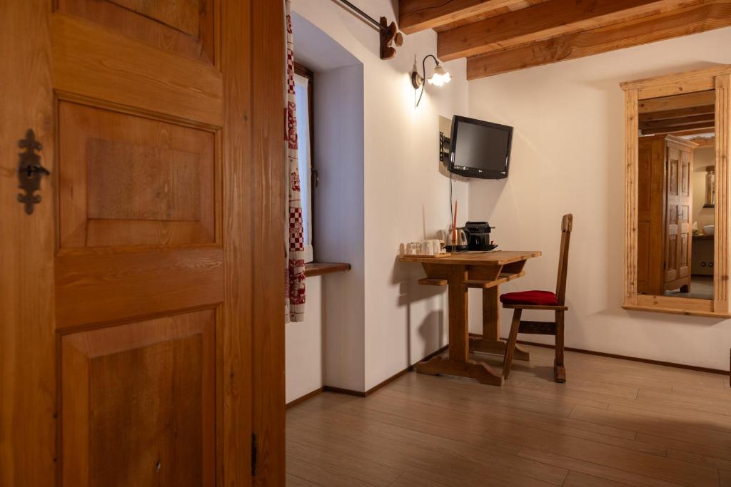 TV a/nebo společenská místnost v ubytování Chalet d'Aoste
