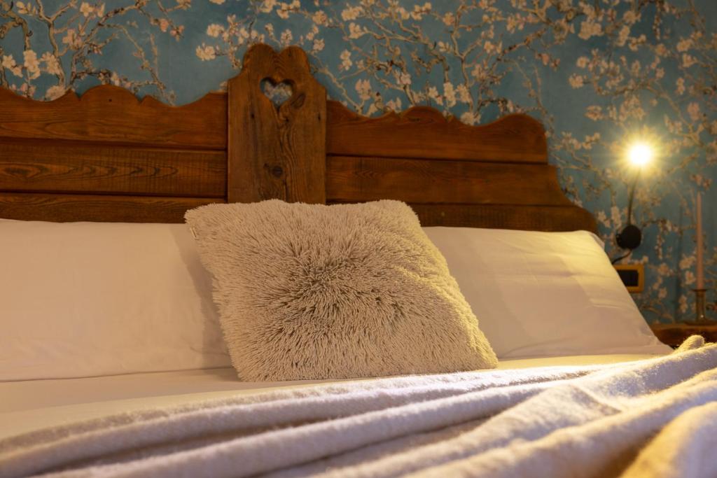 Postel nebo postele na pokoji v ubytování Chalet d'Aoste