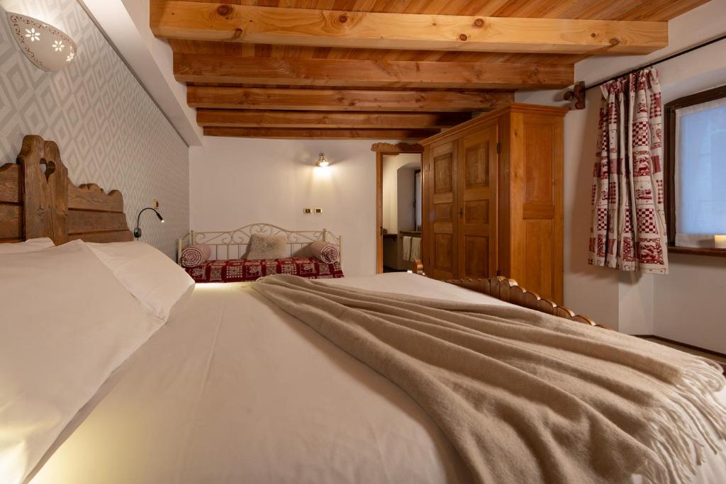 Postel nebo postele na pokoji v ubytování Chalet d'Aoste