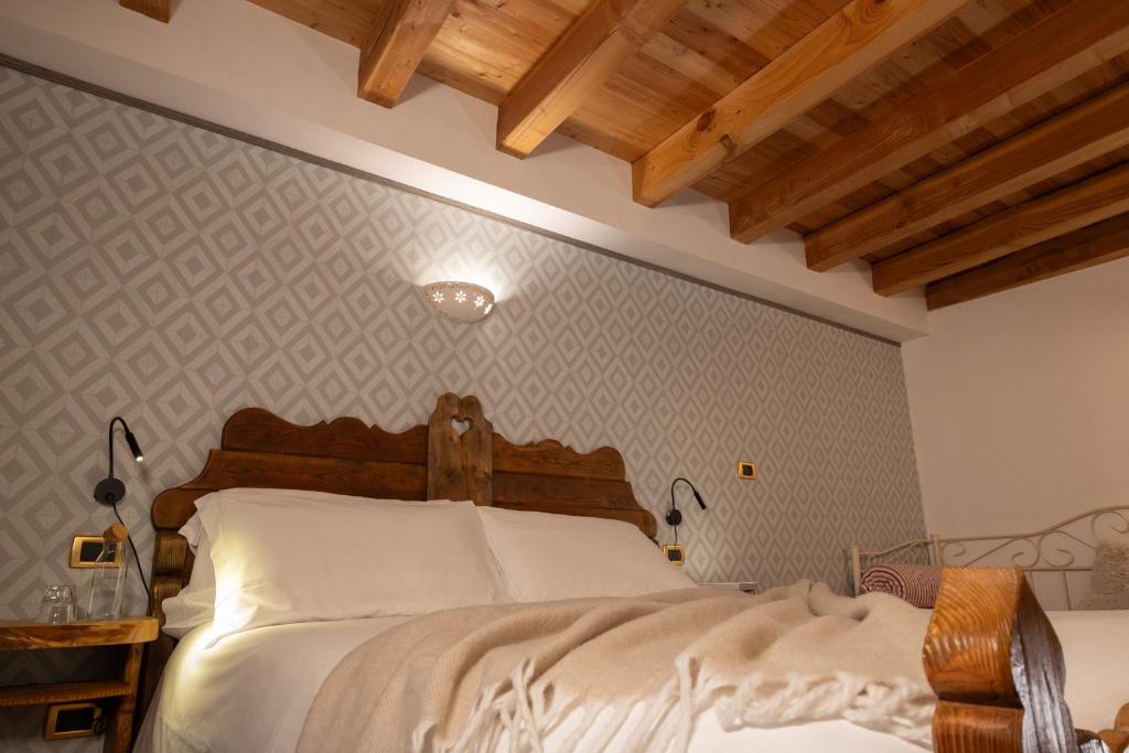 Postel nebo postele na pokoji v ubytování Chalet d'Aoste