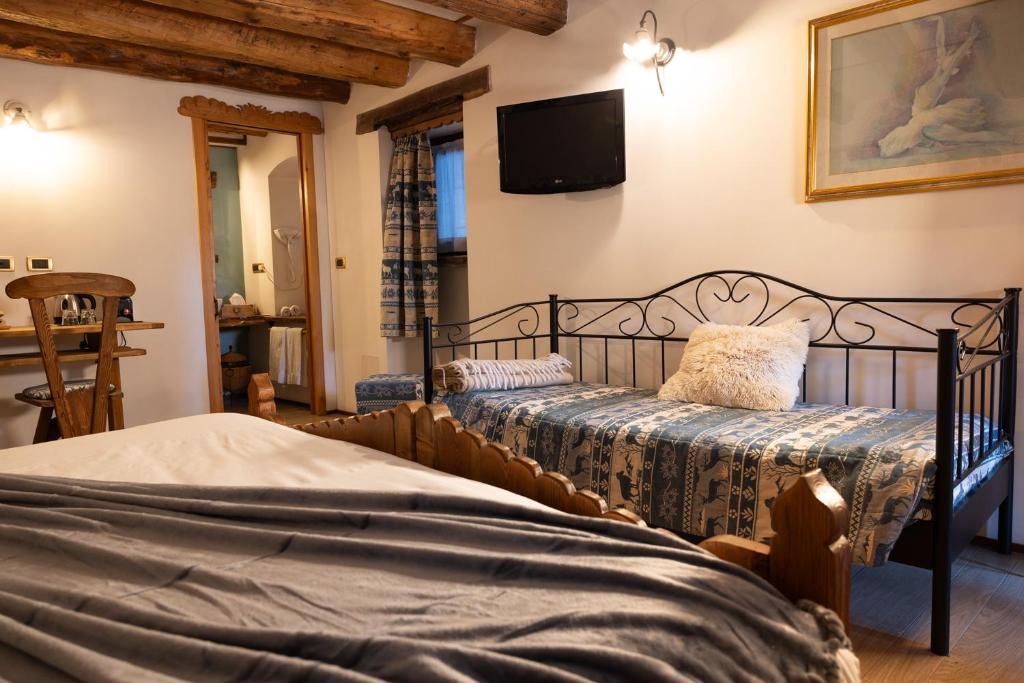 Postel nebo postele na pokoji v ubytování Chalet d'Aoste