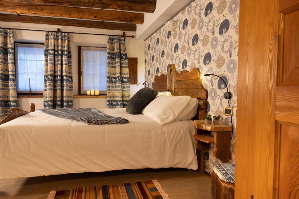 Postel nebo postele na pokoji v ubytování Chalet d'Aoste