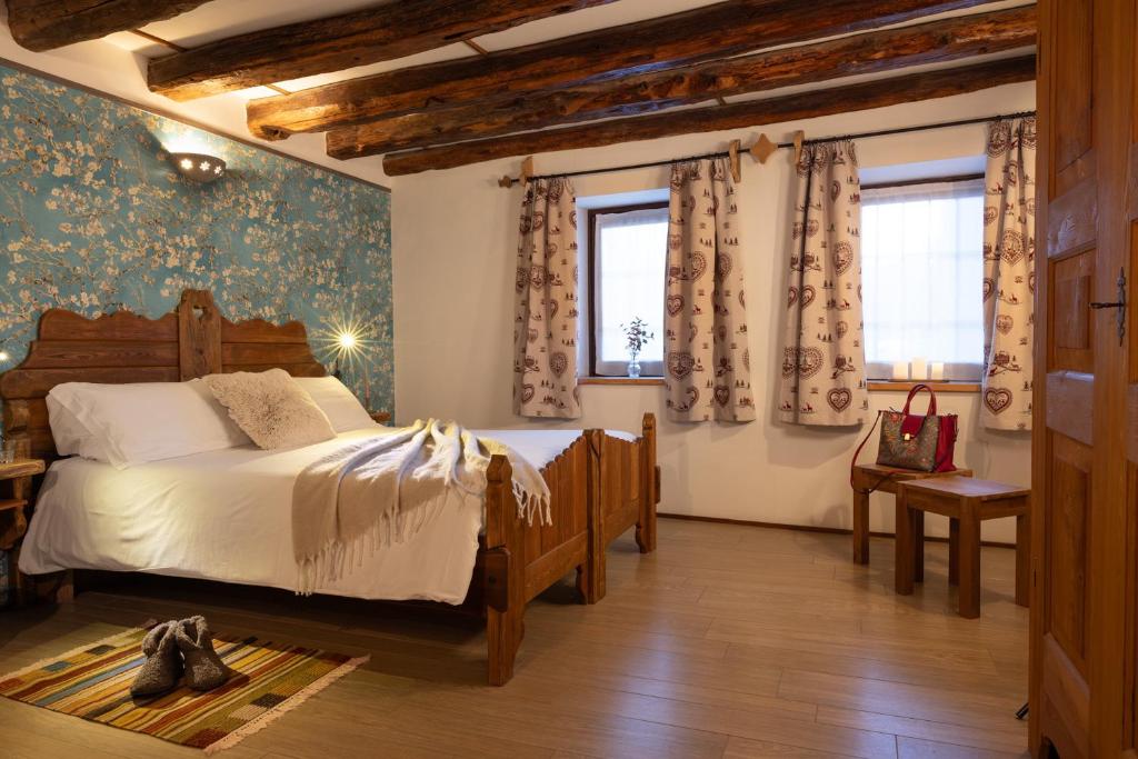 Postel nebo postele na pokoji v ubytování Chalet d'Aoste