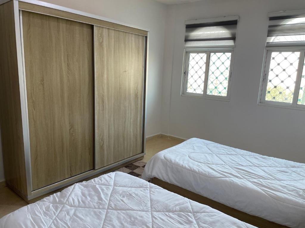 Postel nebo postele na pokoji v ubytování Oskar Appartment