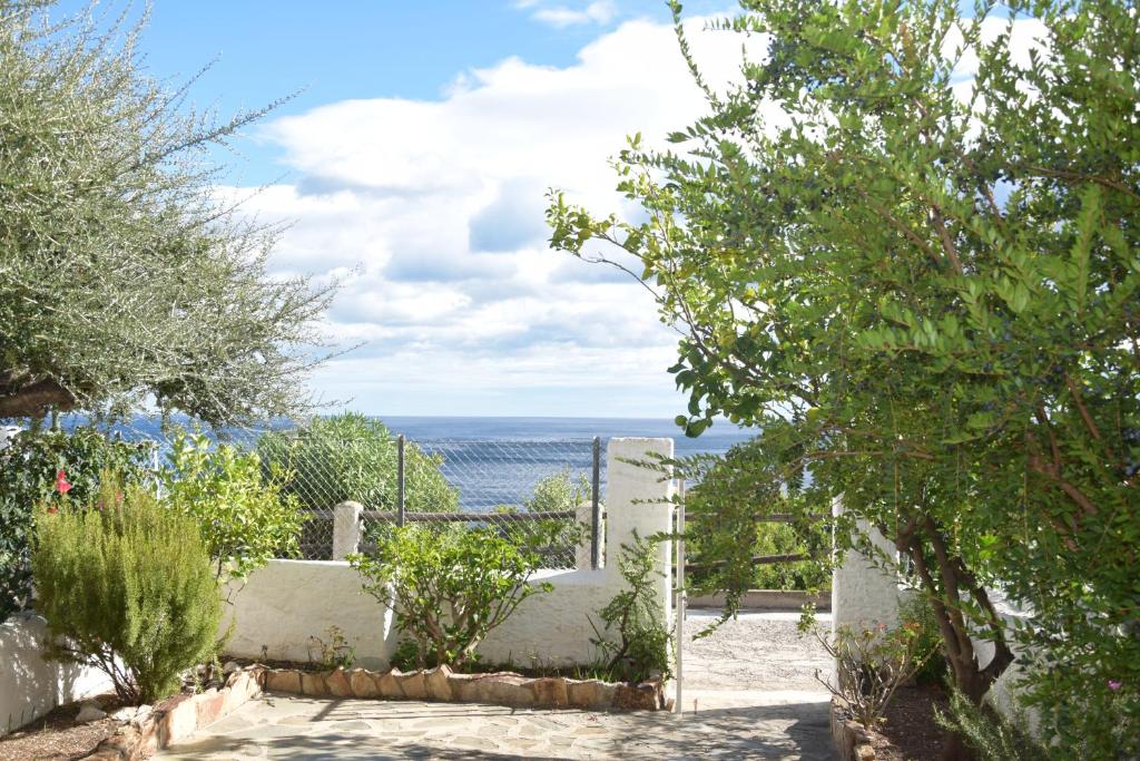 a view of the ocean from a garden at Finestra sul mare in Cala Gonone