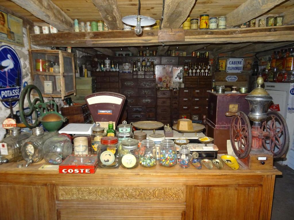 a counter with a lot of items on it at Le Clos Fleuri in Caumont