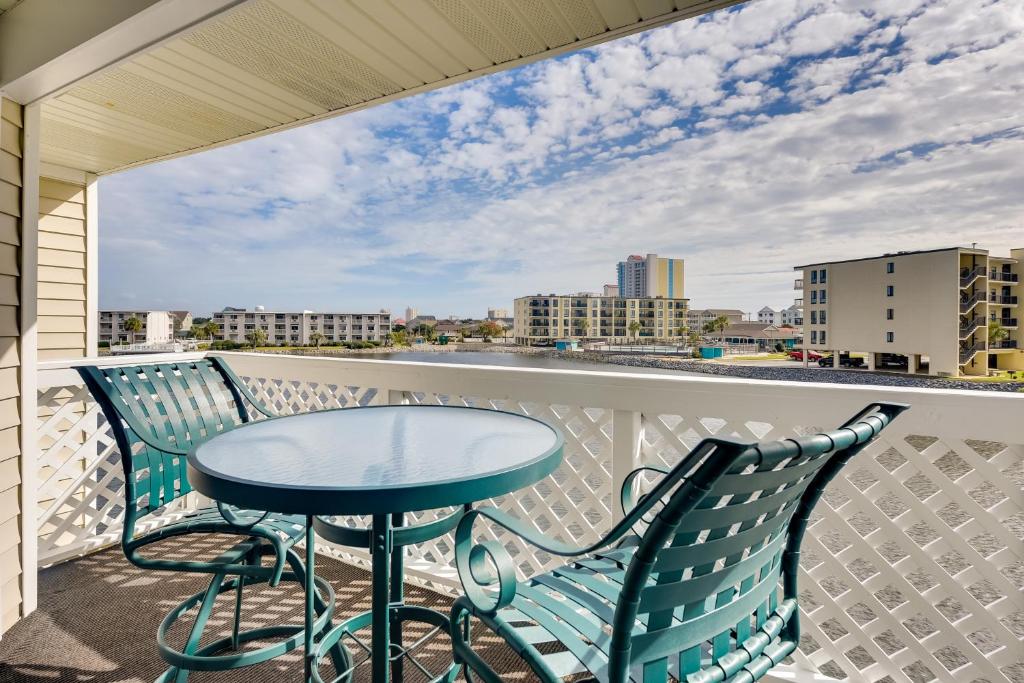 a table and chairs on a balcony with a view at North Myrtle Beach Condo Community Pool and Hot Tub in Myrtle Beach