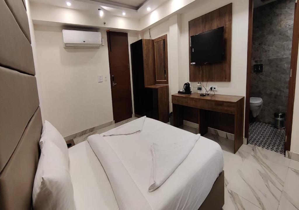 Postel nebo postele na pokoji v ubytování PK Boutique Hotel