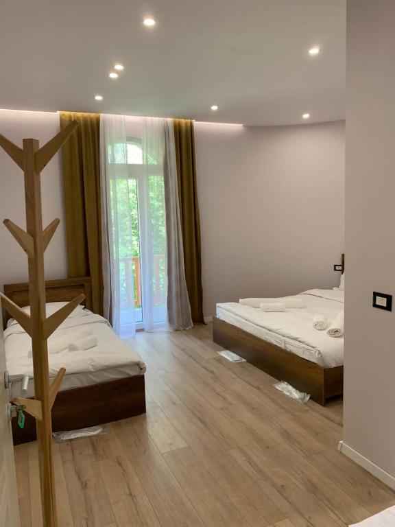 Postel nebo postele na pokoji v ubytování Stonehouse villa