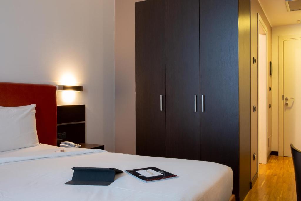 Postel nebo postele na pokoji v ubytování Euro Hotel Residence