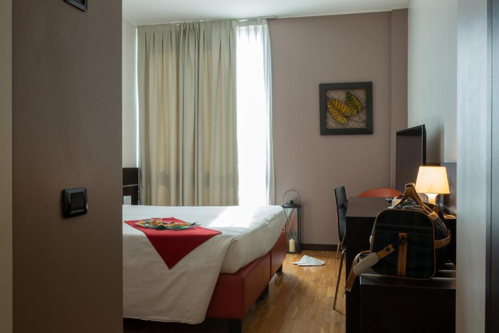 Postel nebo postele na pokoji v ubytování Euro Hotel Residence